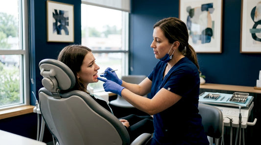 Dentist examining damaged teeth in clinic