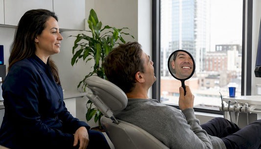 Dentist consulting patient on teeth whitening