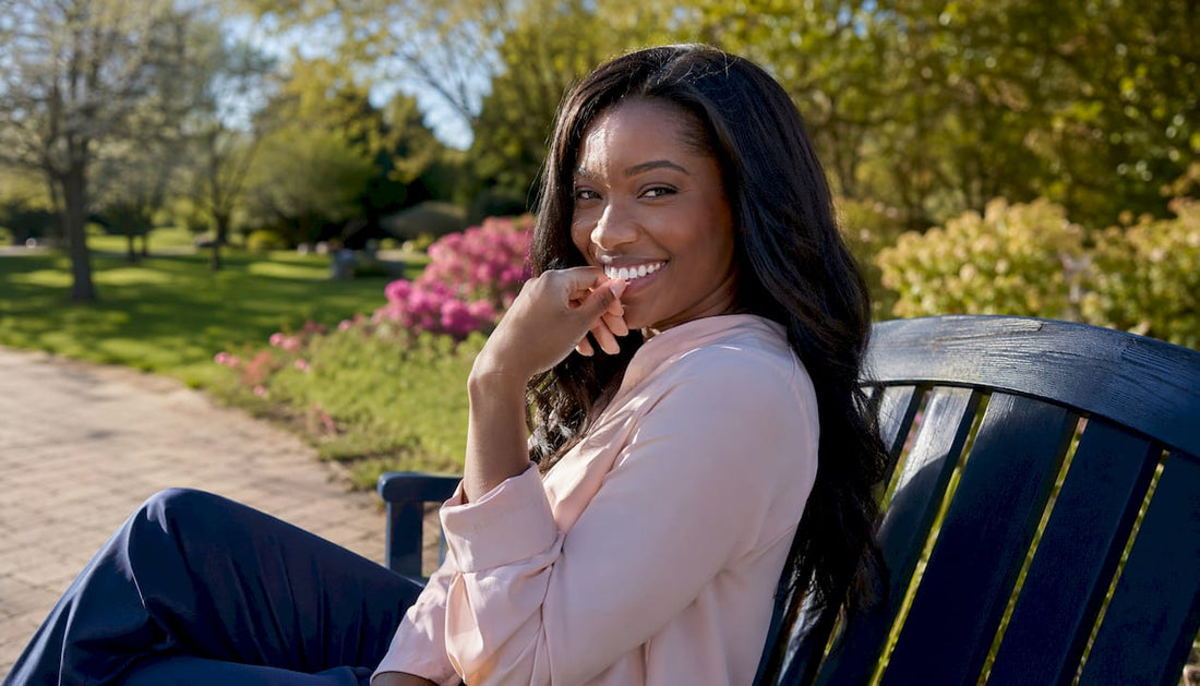 Confident young woman smiling in café