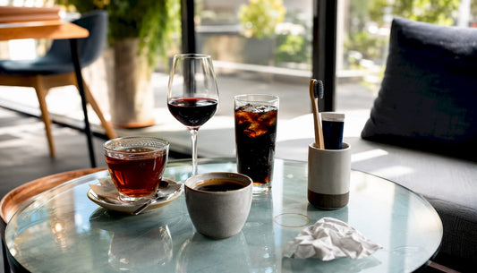 Beverages that stain teeth on a wooden table