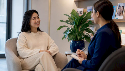 Asian woman consulting dentist about teeth whitening
