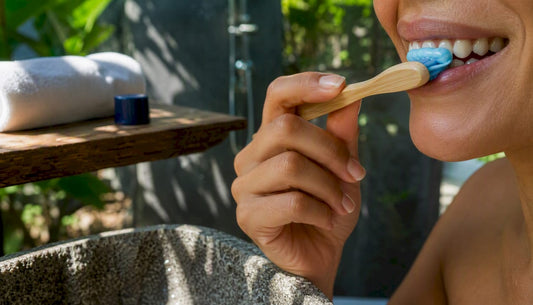 Close-up of brushing teeth with blue toothpaste